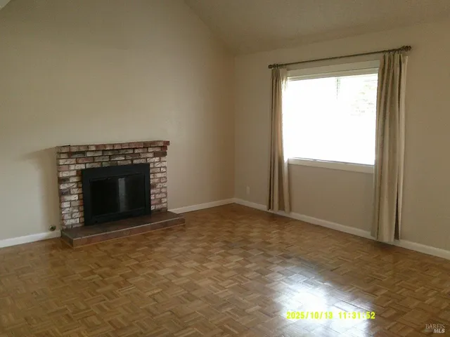 an empty room with a fireplace