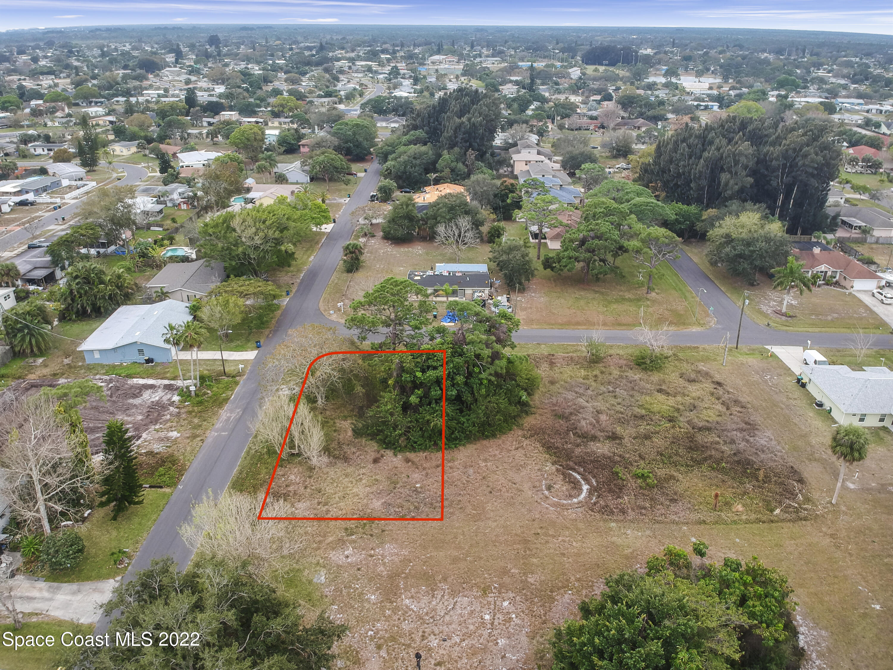 1198 Ver Circle Northeast Palm Bay, FL 32905 - Photo 6 of 7 an aerial view of residential houses with outdoor space