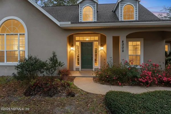 a view of house with outdoor space porch and entertaining space