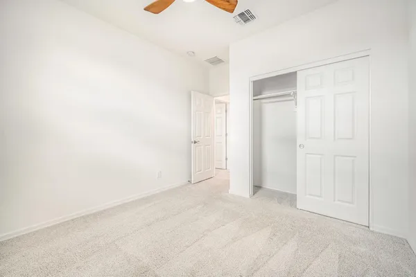 an empty room with a empty space and windows