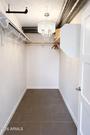 a bathroom with a double vanity sink toilet and shower