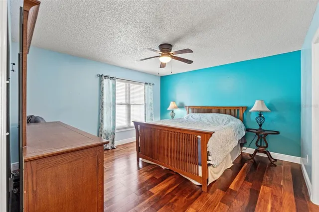 a bed room with a bed and a chandelier