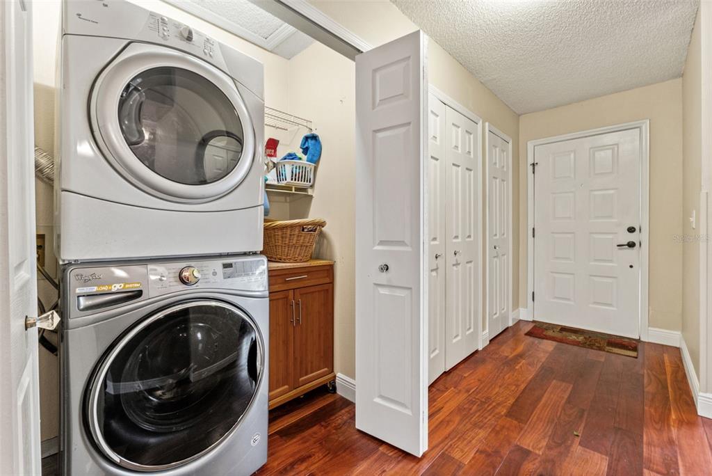 7828 Hardwick Drive, Unit 924 New Port Richey, FL 34653 - Photo 18 of 35 a view of a hallway with washer and dryer