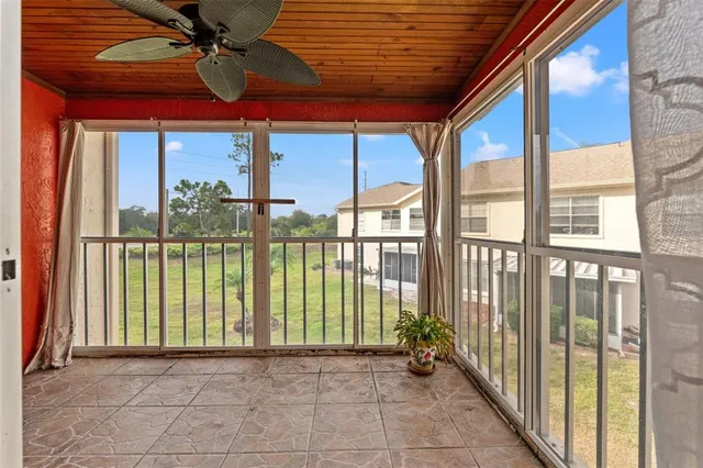 a view of a porch with a floor to ceiling window