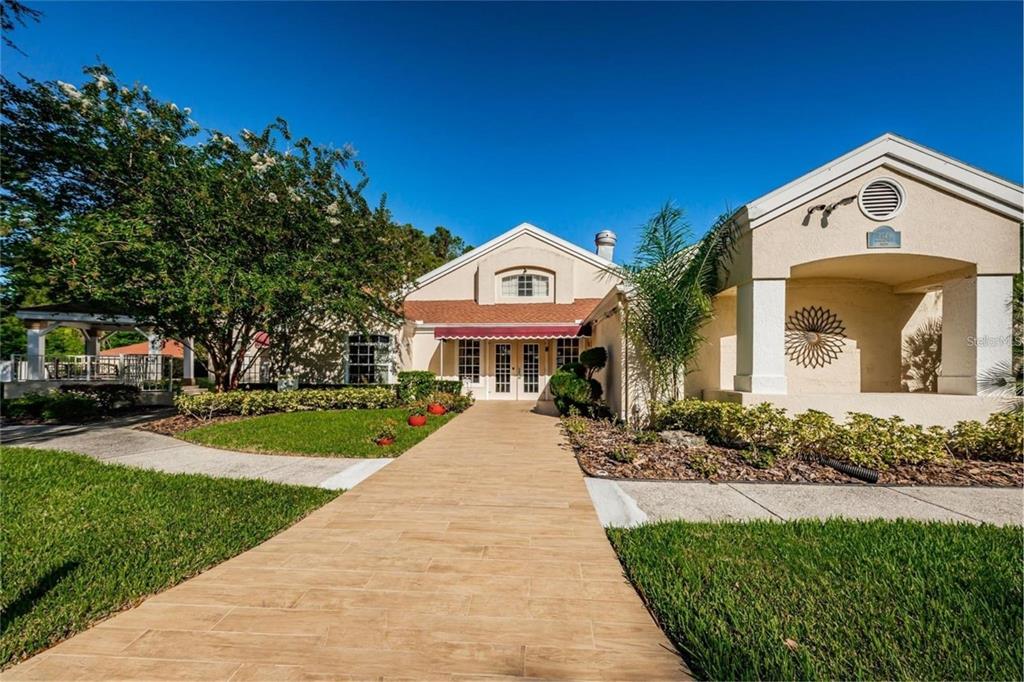 7828 Hardwick Drive, Unit 924 New Port Richey, FL 34653 - Photo 32 of 35 a front view of a house with a yard