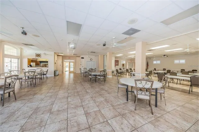 a kitchen with stainless steel appliances granite countertop a sink counter space cabinets and a large window