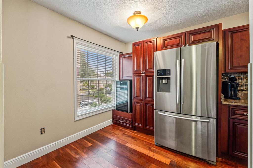 7828 Hardwick Drive, Unit 924 New Port Richey, FL 34653 - Photo 6 of 35 a metallic refrigerator freezer sitting in a kitchen