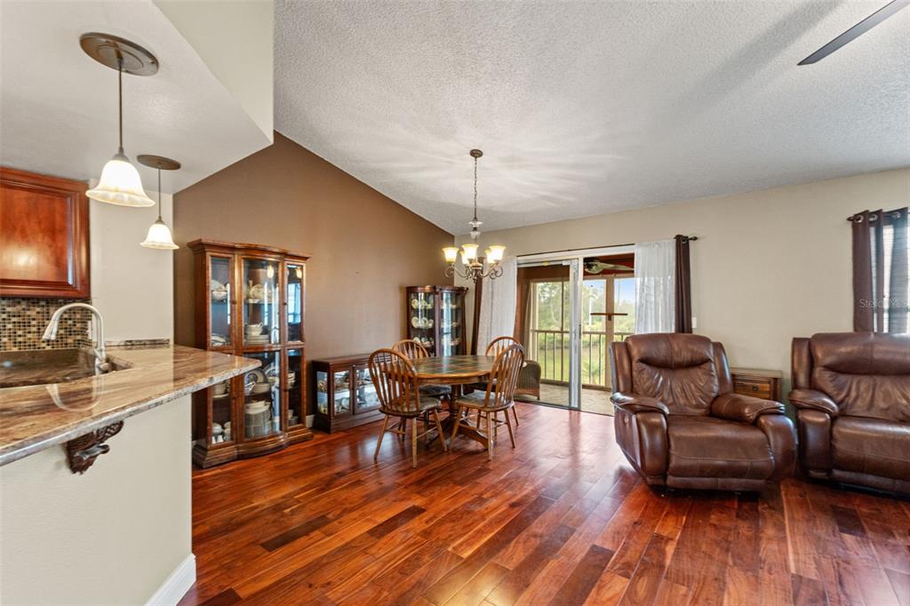 7828 Hardwick Drive, Unit 924 New Port Richey, FL 34653 - Photo 7 of 35 a living room with furniture and wooden floor