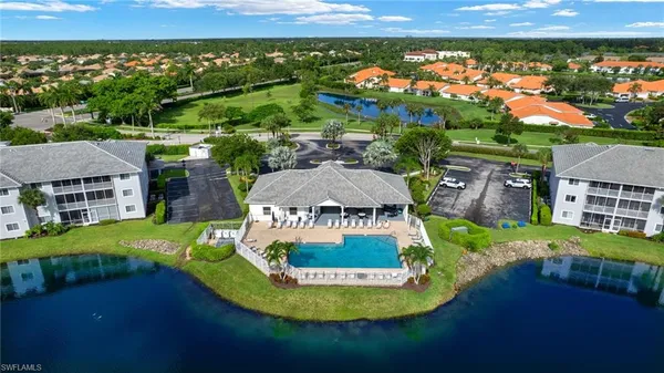 a view of a lake with a table and chairs