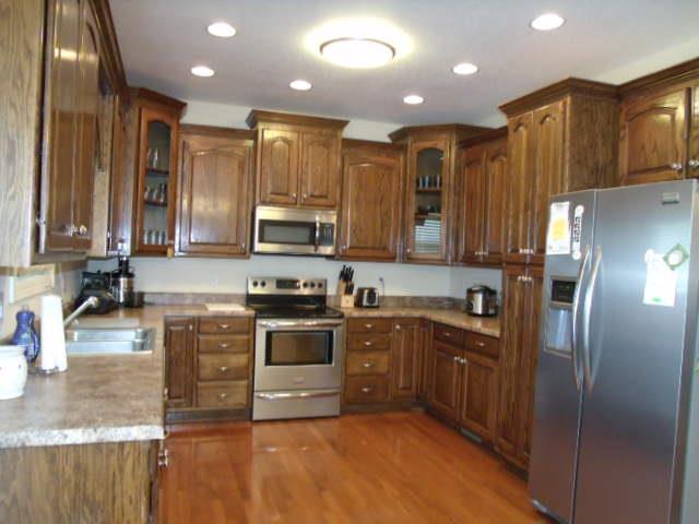 2190 Lynchburg Road Winchester, TN 37398 - Photo 6 of 17 a kitchen with stainless steel appliances granite countertop a refrigerator a stove top oven a sink and dishwasher