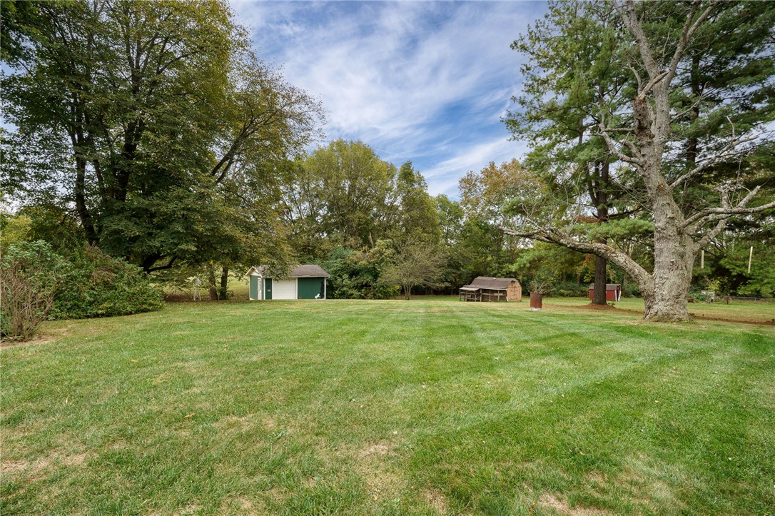 6950 Red Lion 5 Points Road Springboro, OH 45066 - Photo 62 of 78 Expansive green yard with mature trees offers a serene natural setting and two storage sheds.