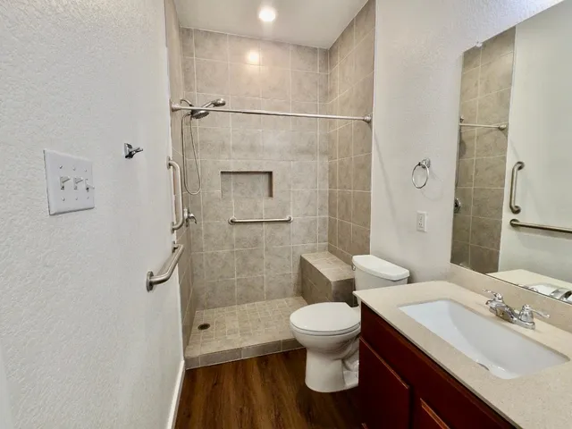 a view of an empty room and wooden floor