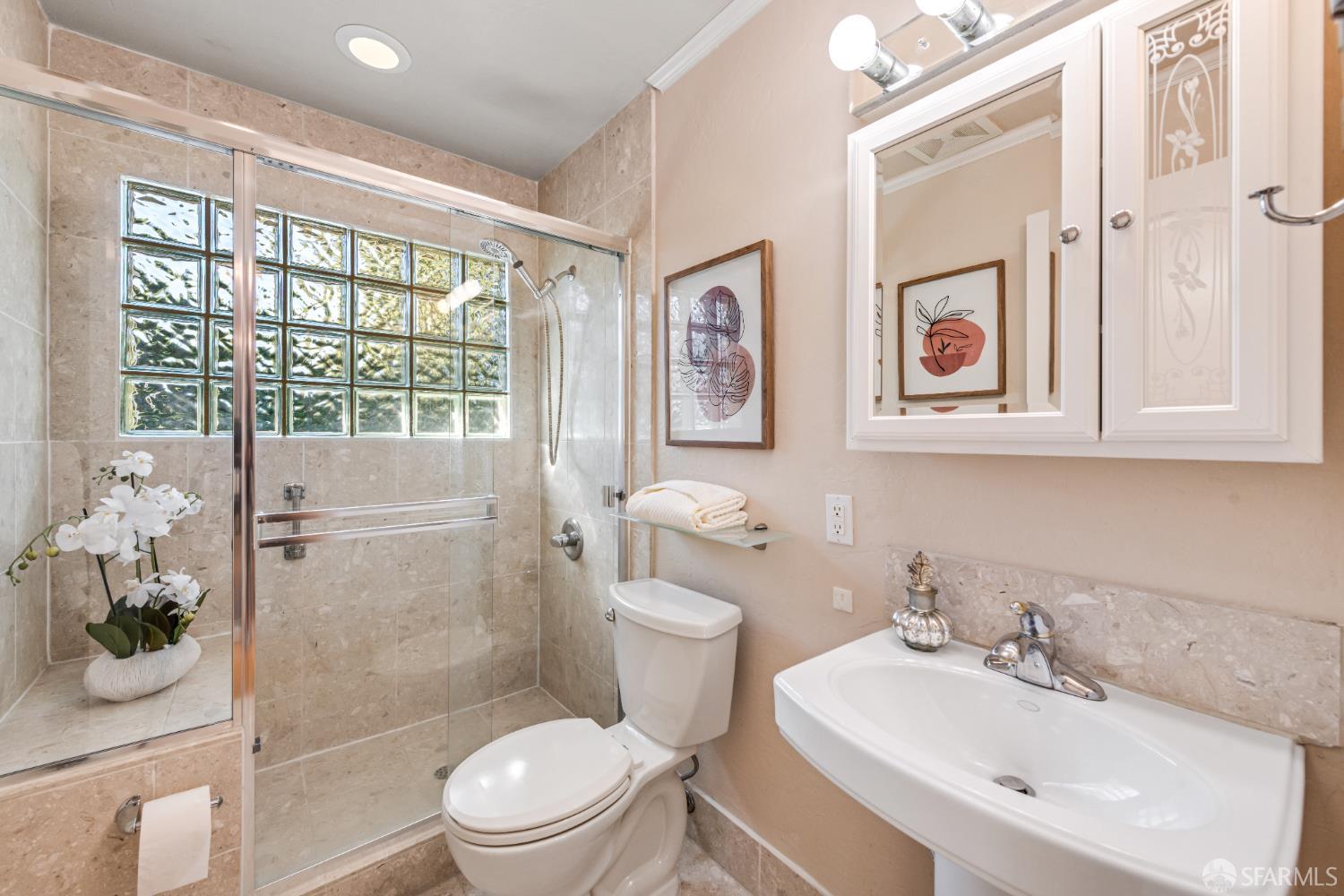 1284 Columbus Street El Granada, CA 94019 - Photo 13 of 15 a bathroom with a sink a toilet and shower