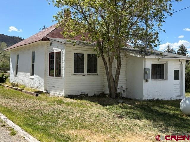 116 South Mary Street Ridgway, CO 81432 - Photo 18 of 23 a view of a white house with a yard