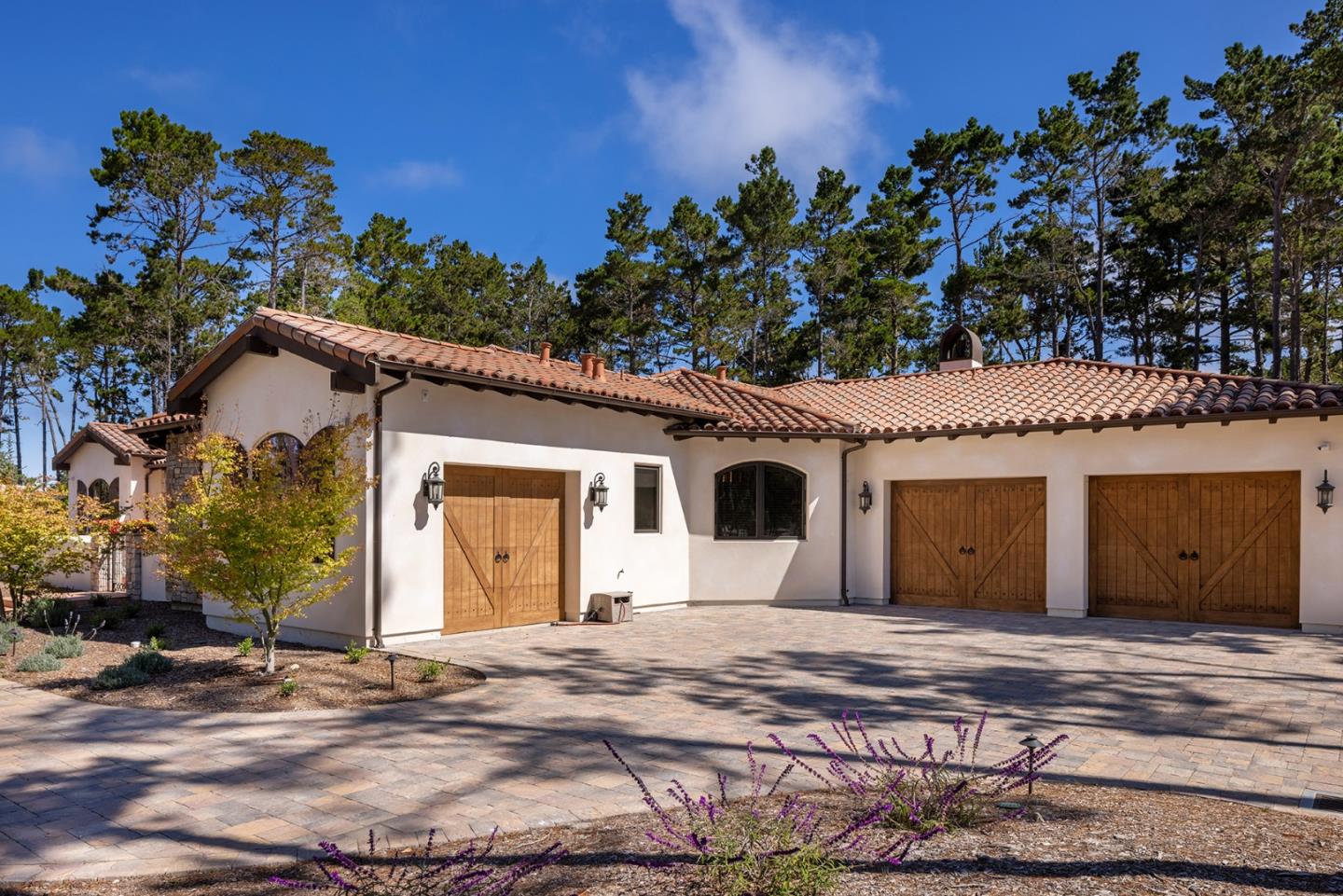 1437 Viscaino Road Pebble Beach, CA 93953 - Photo 30 of 30 a view of a house with a yard and garage