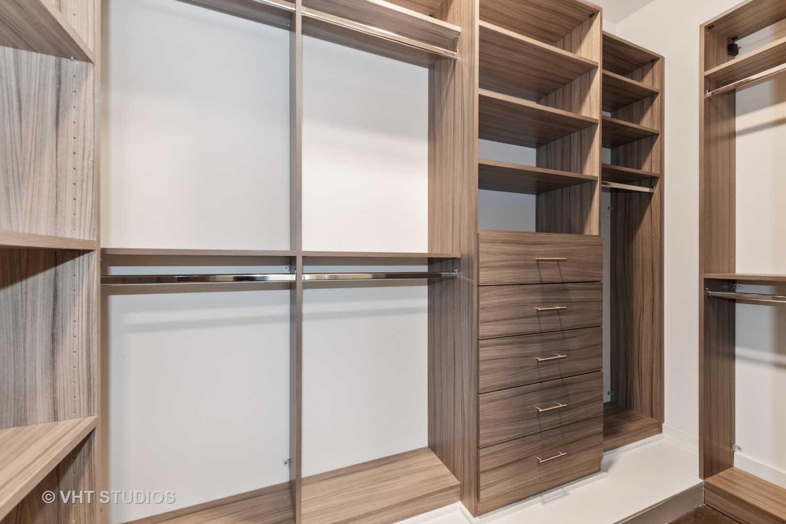 558 Willow Road Winnetka, IL 60093 - Photo 19 of 43 a view of walk in closet with empty racks