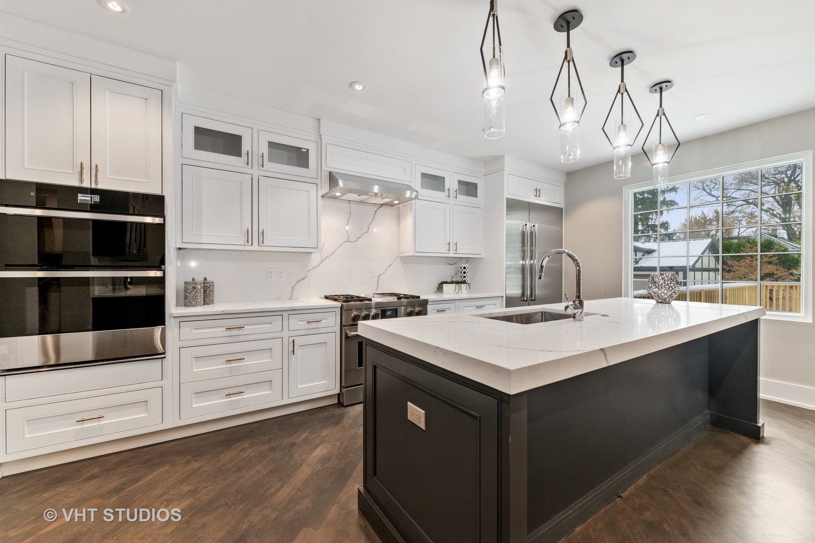558 Willow Road Winnetka, IL 60093 - Photo 3 of 43 a kitchen with a sink stove and cabinets