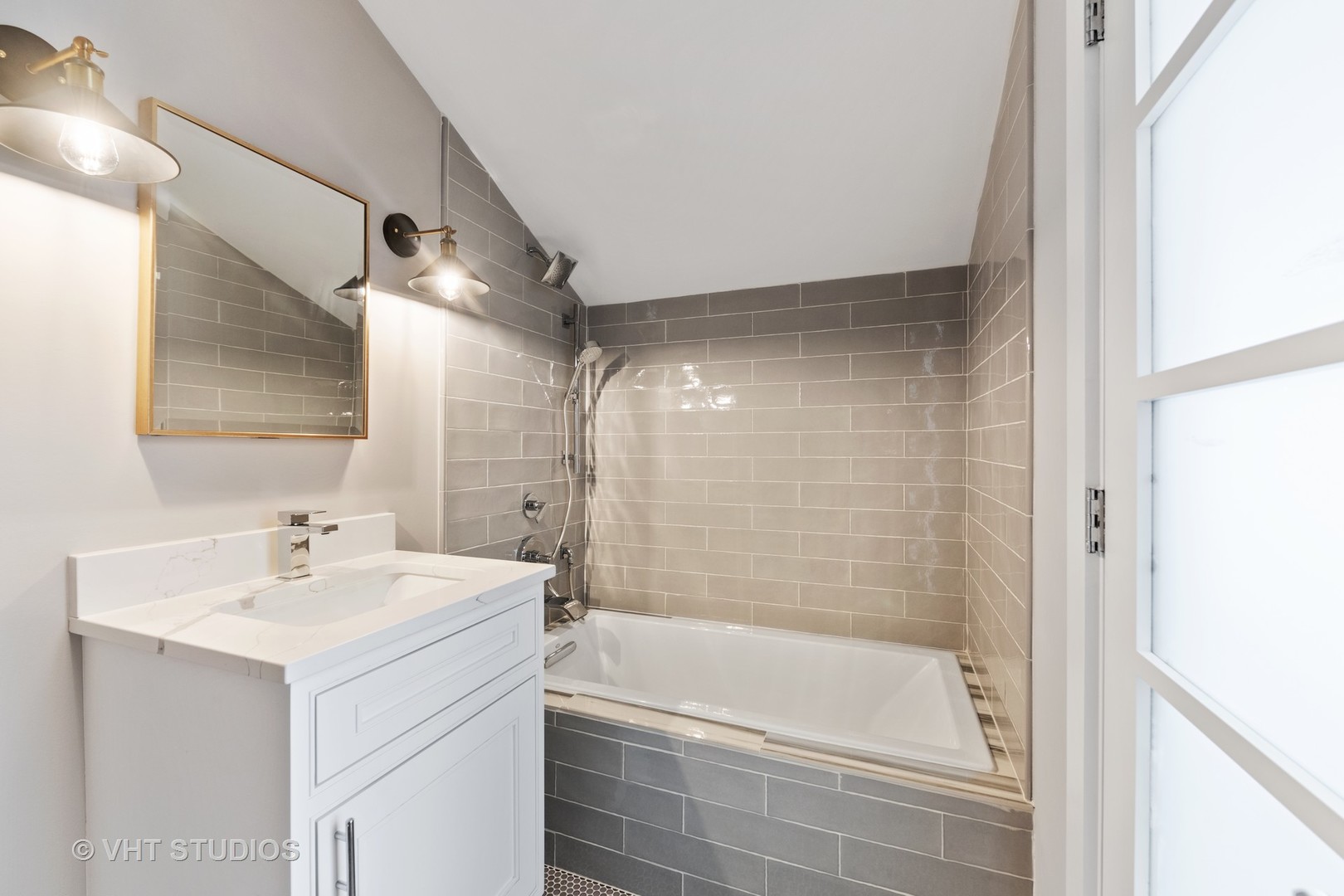 558 Willow Road Winnetka, IL 60093 - Photo 26 of 43 a bathroom with a bathtub a shower a sink and a sink