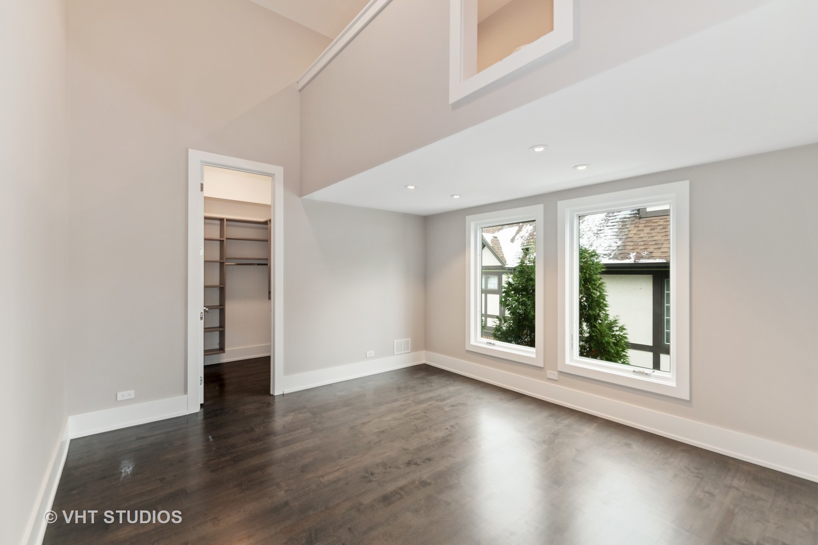 558 Willow Road Winnetka, IL 60093 - Photo 27 of 43 an empty room with wooden floor and windows