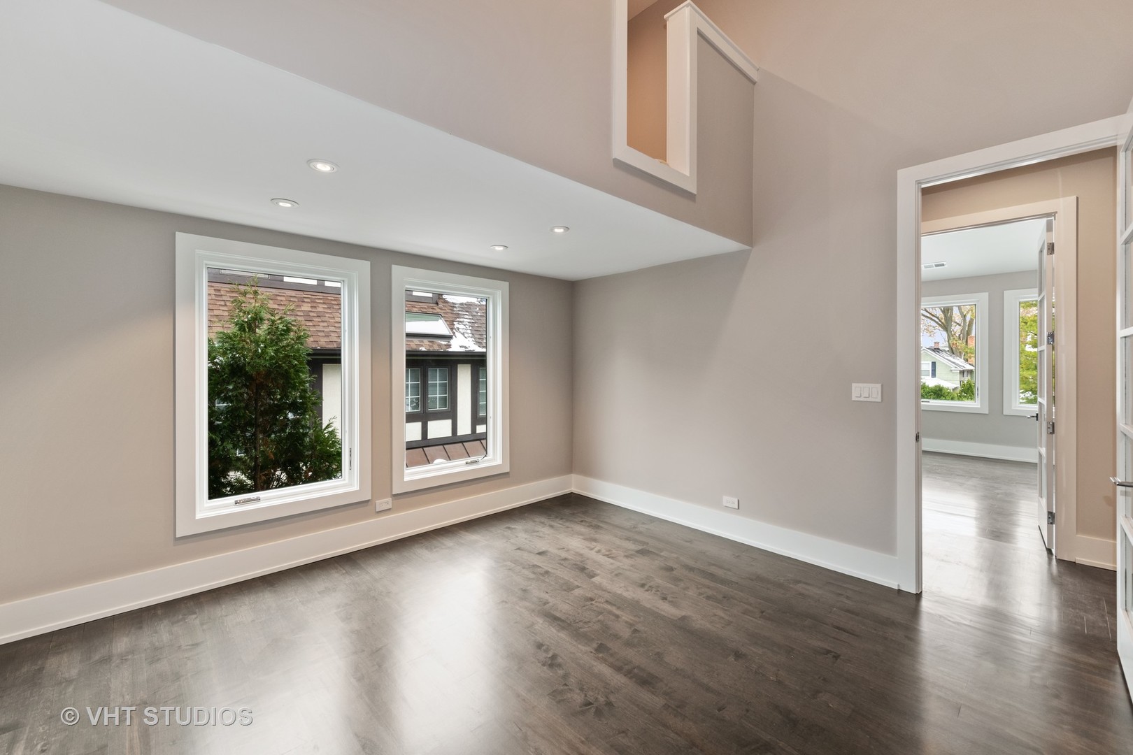 558 Willow Road Winnetka, IL 60093 - Photo 28 of 43 a view of an empty room with wooden floor and a window