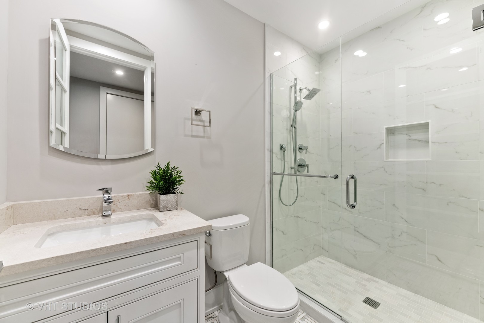 558 Willow Road Winnetka, IL 60093 - Photo 33 of 43 a bathroom with a sink a toilet and shower