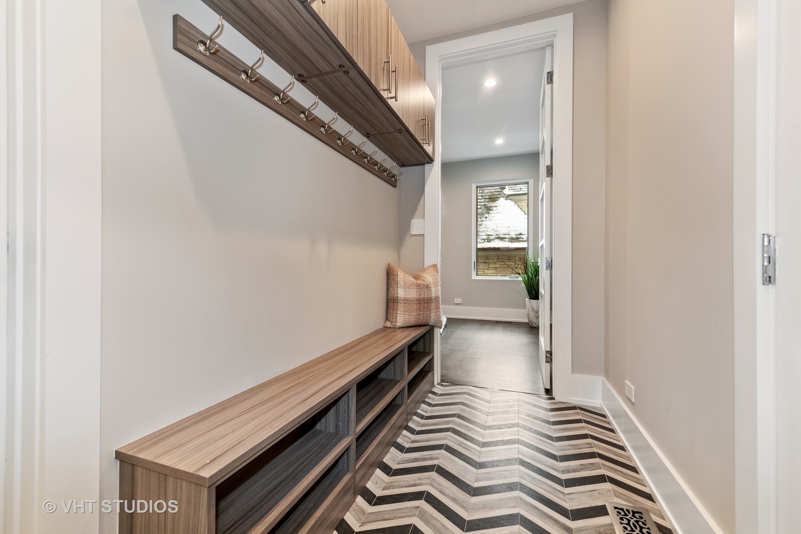 558 Willow Road Winnetka, IL 60093 - Photo 34 of 43 a view of a hallway with wooden floor and staircase