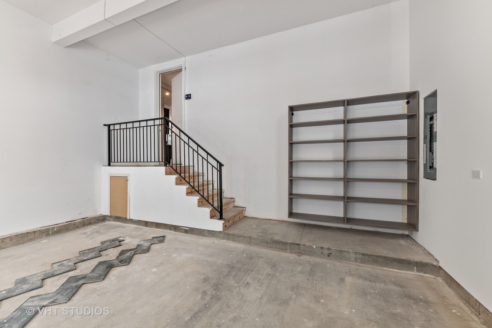 558 Willow Road Winnetka, IL 60093 - Photo 35 of 43 a view of an empty room with stairs and a window