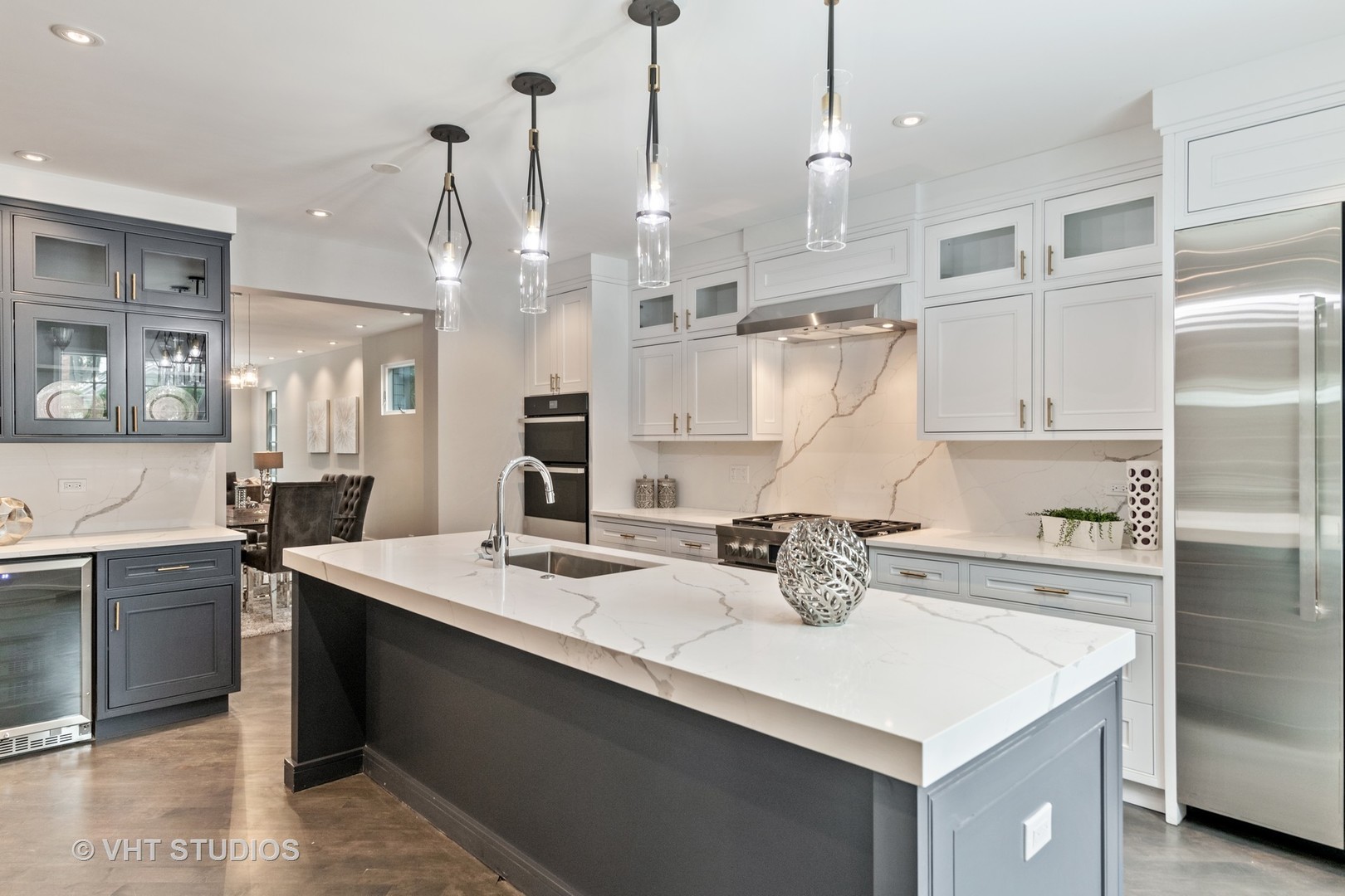 558 Willow Road Winnetka, IL 60093 - Photo 6 of 43 a kitchen with a sink a stove a refrigerator and white cabinets