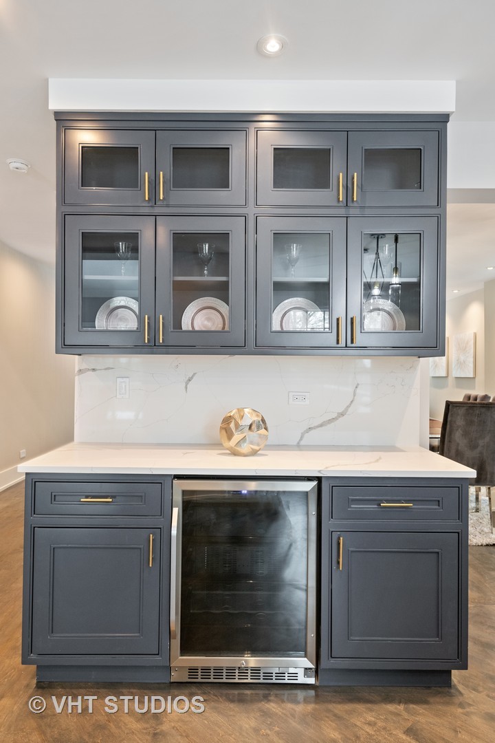 558 Willow Road Winnetka, IL 60093 - Photo 7 of 43 a stove top oven sitting inside of a kitchen
