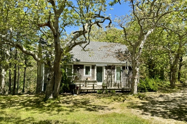 47 Quenames Road Chilmark, MA 02535 - Photo 9 of 11 a view of a house with a large tree