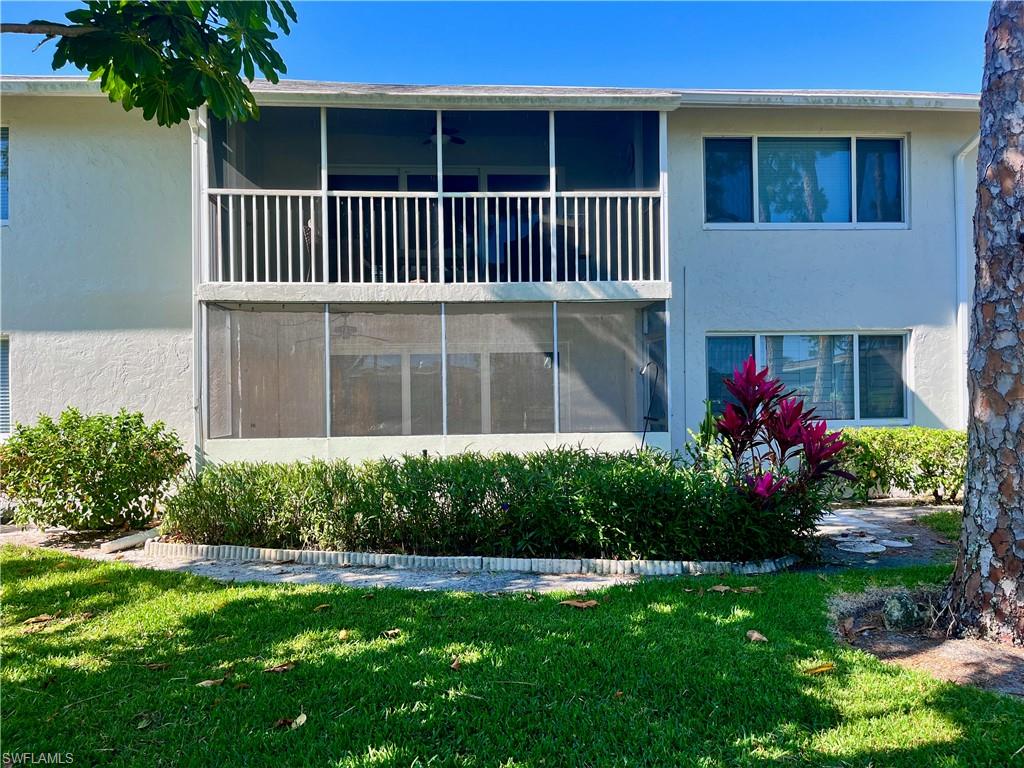 202 Peppermint Lane, Unit 2 Naples, FL 34112 - Photo 15 of 23 a house view with a garden space