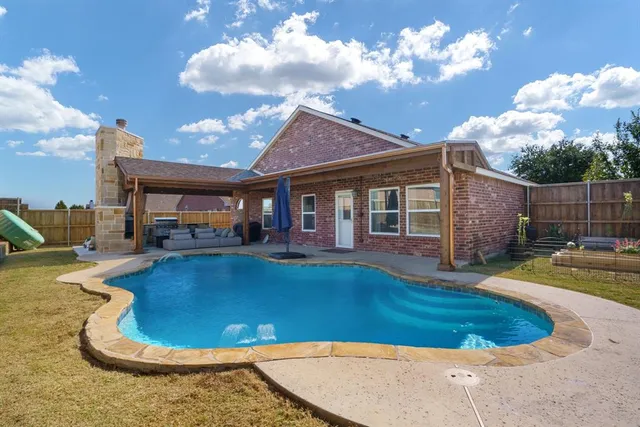 a view of a house with swimming pool