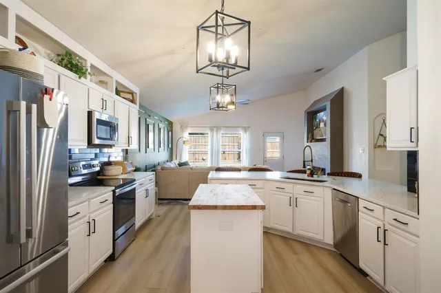 an aerial view of a house with a swimming pool