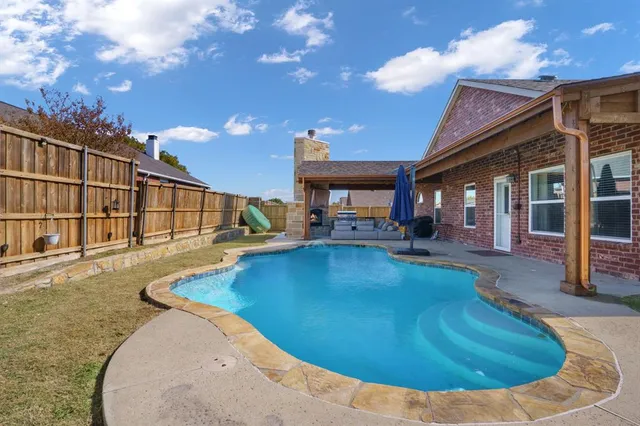 a view of a house with swimming pool