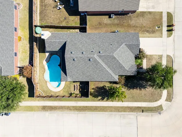 an aerial view of residential building and parking space