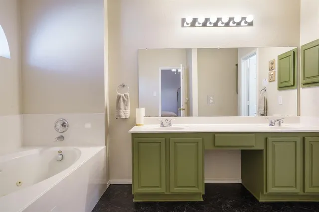 a bathroom with a sink and a bathtub