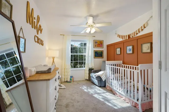 a bedroom with furniture and a window