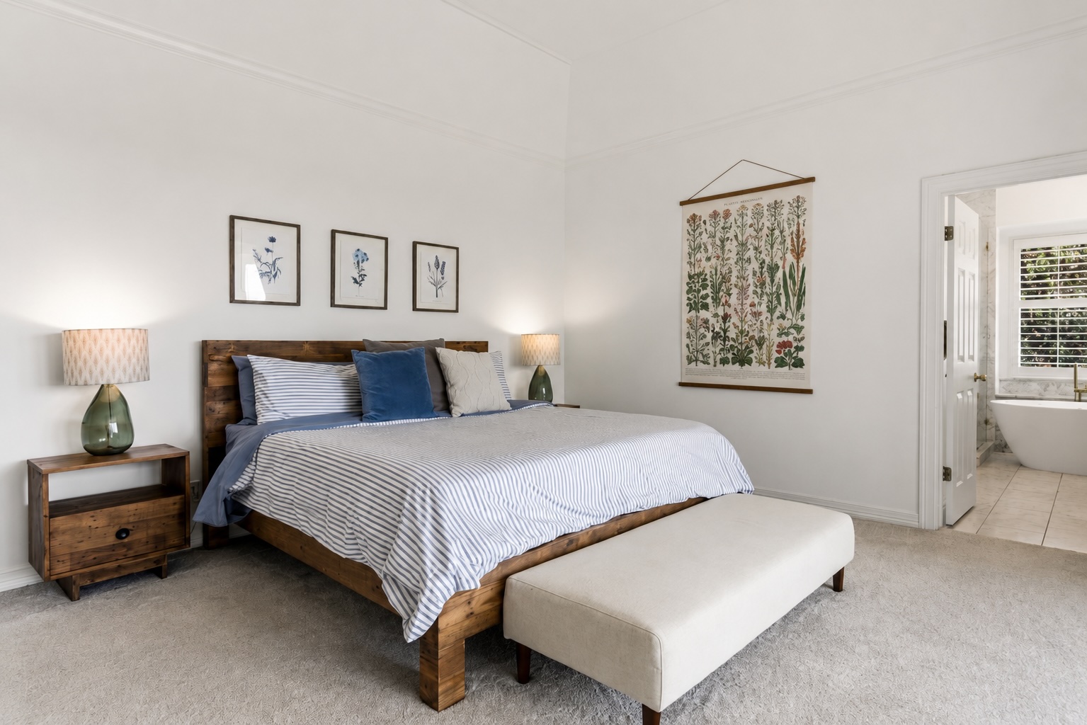 3107 Lookout Lane Austin, TX 78746 - Photo 23 of 39 A tranquil primary bedroom suite with plush carpeting and a private entrance to a spa-like bath.
