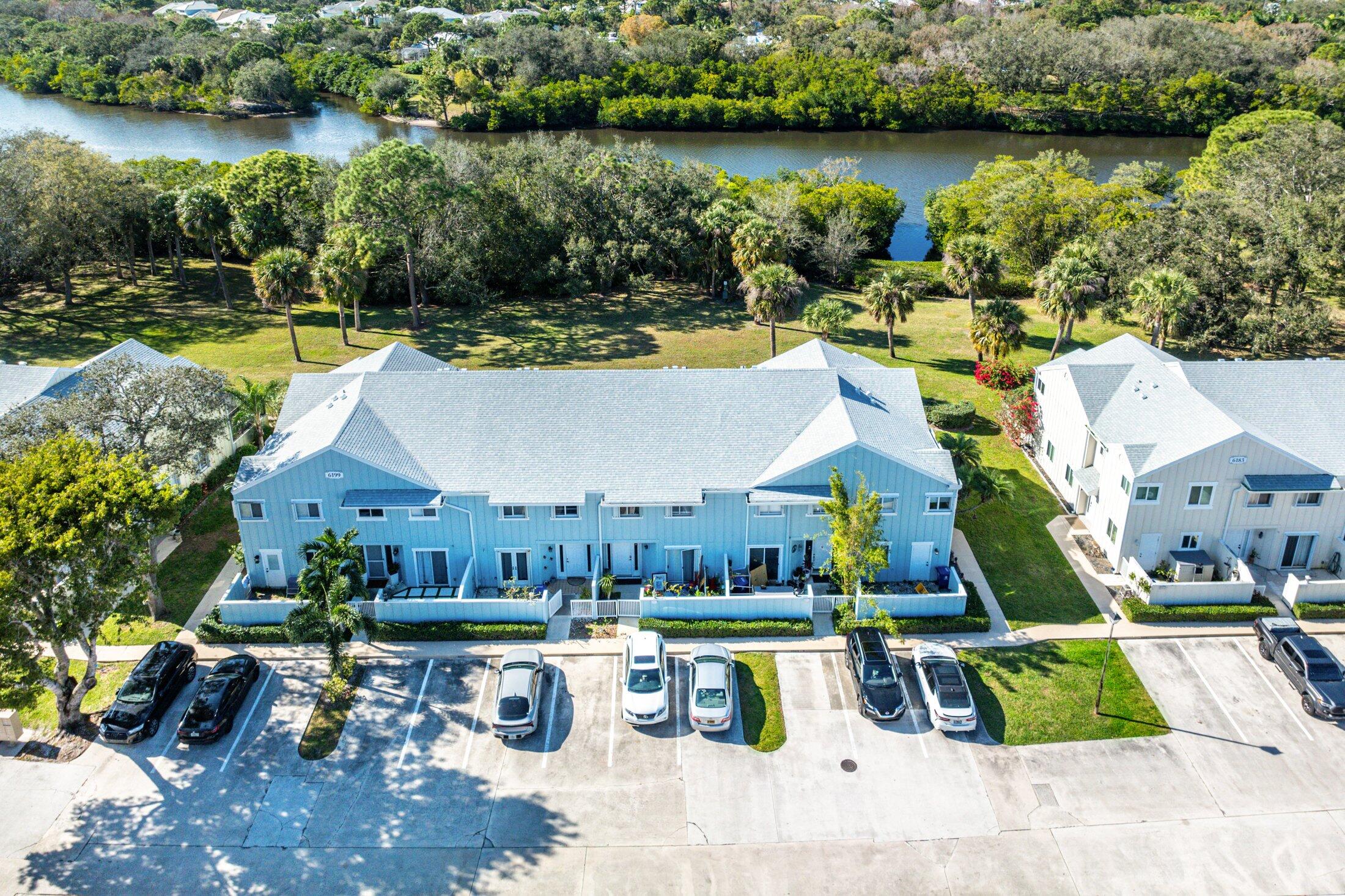 an aerial view of a house with swimming pool garden and patio
