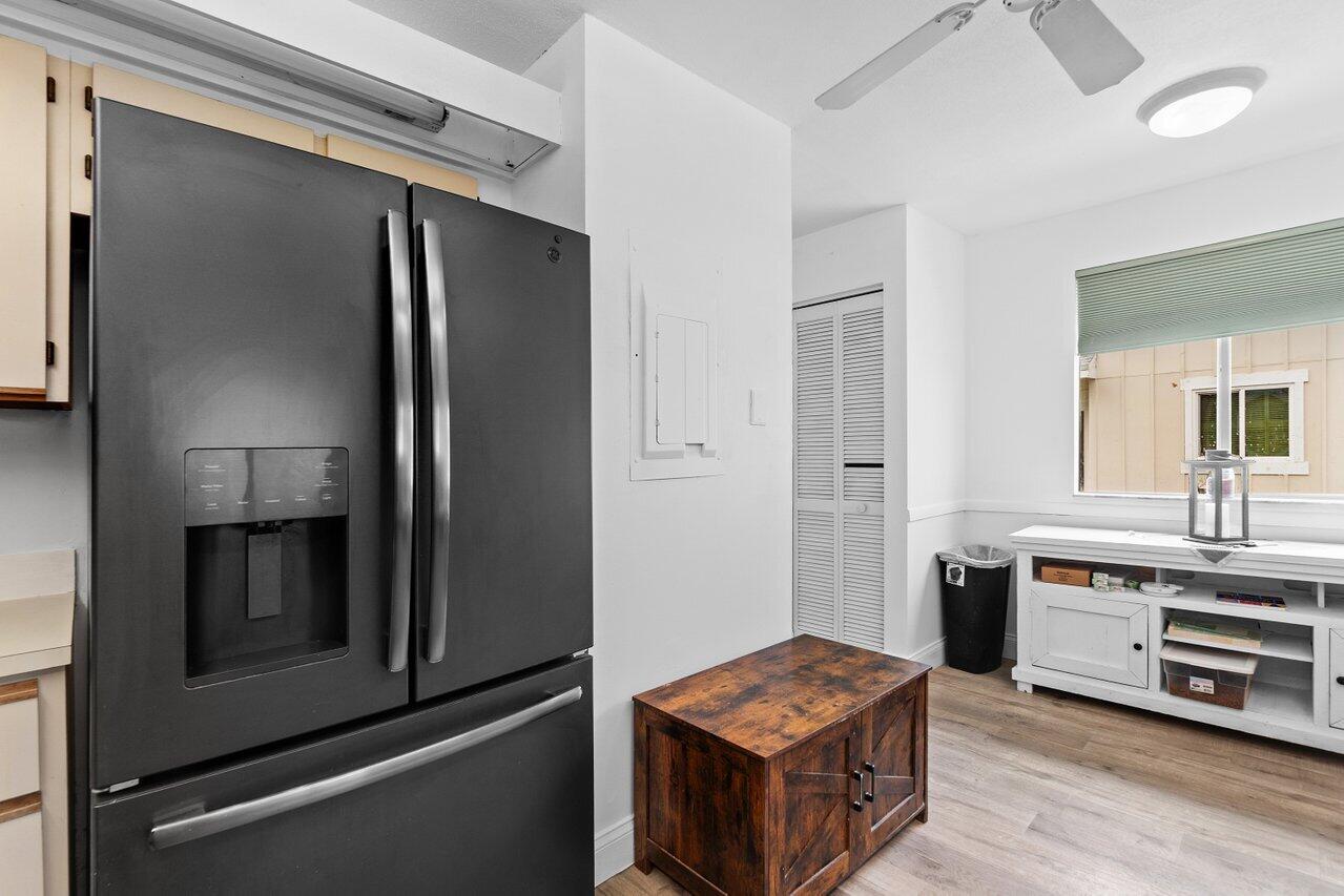 6199 Riverwalk Lane, Unit 6 Jupiter, FL 33458 - Photo 15 of 33 a kitchen with stainless steel appliances a stove a refrigerator and cabinets