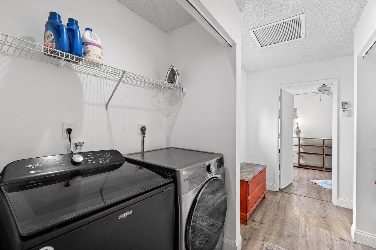 6199 Riverwalk Lane, Unit 6 Jupiter, FL 33458 - Photo 22 of 33 a utility room with dryer and washer