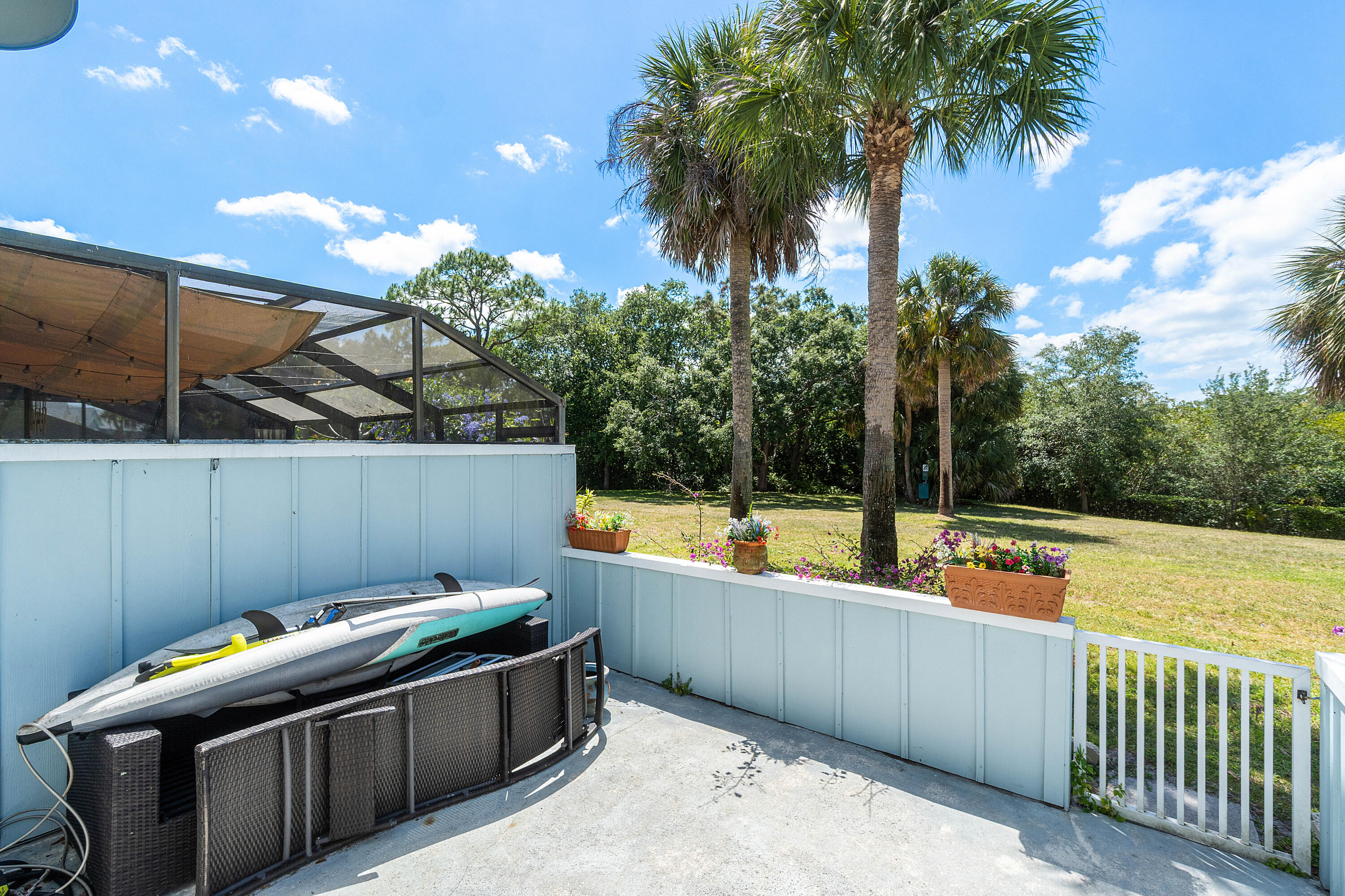 6199 Riverwalk Lane, Unit 6 Jupiter, FL 33458 - Photo 24 of 33 a view of a swimming pool with a lounge chair