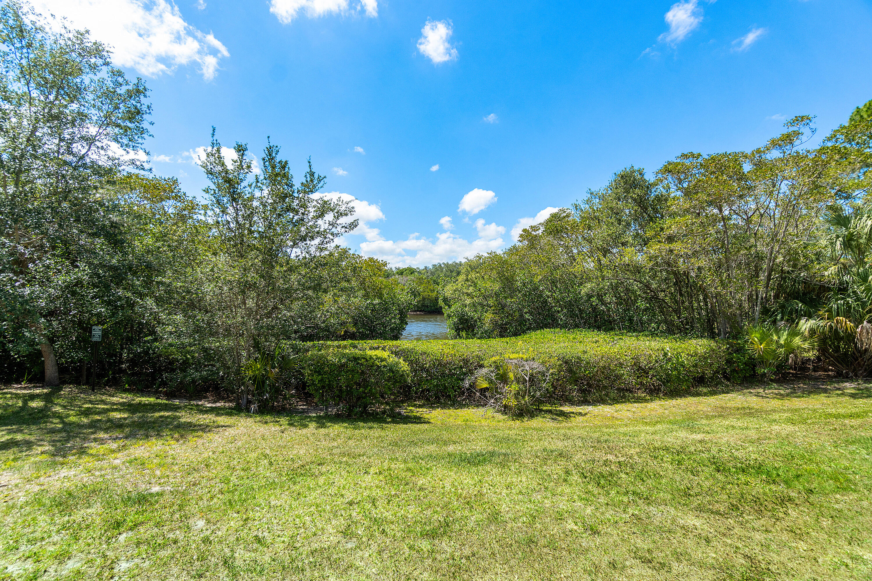 6199 Riverwalk Lane, Unit 6 Jupiter, FL 33458 - Photo 26 of 33 a view of a garden with large trees