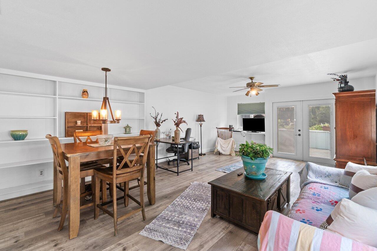 6199 Riverwalk Lane, Unit 6 Jupiter, FL 33458 - Photo 8 of 33 a living room with furniture and a chandelier