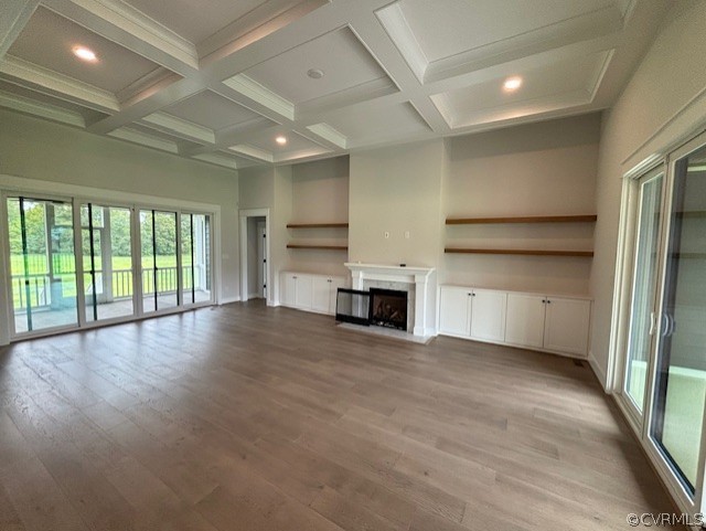 6030 Studley Road Mechanicsville, VA 23116 - Photo 3 of 14 an empty room with wooden floor fireplace and windows