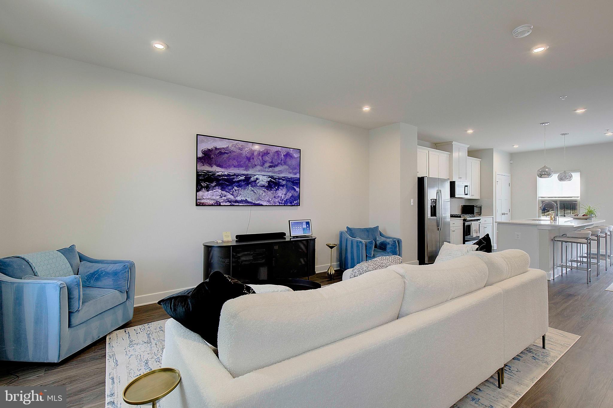 121 Swanson Creek Terrace Laurel, MD 20708 - Photo 11 of 31 a living room with furniture and a flat screen tv