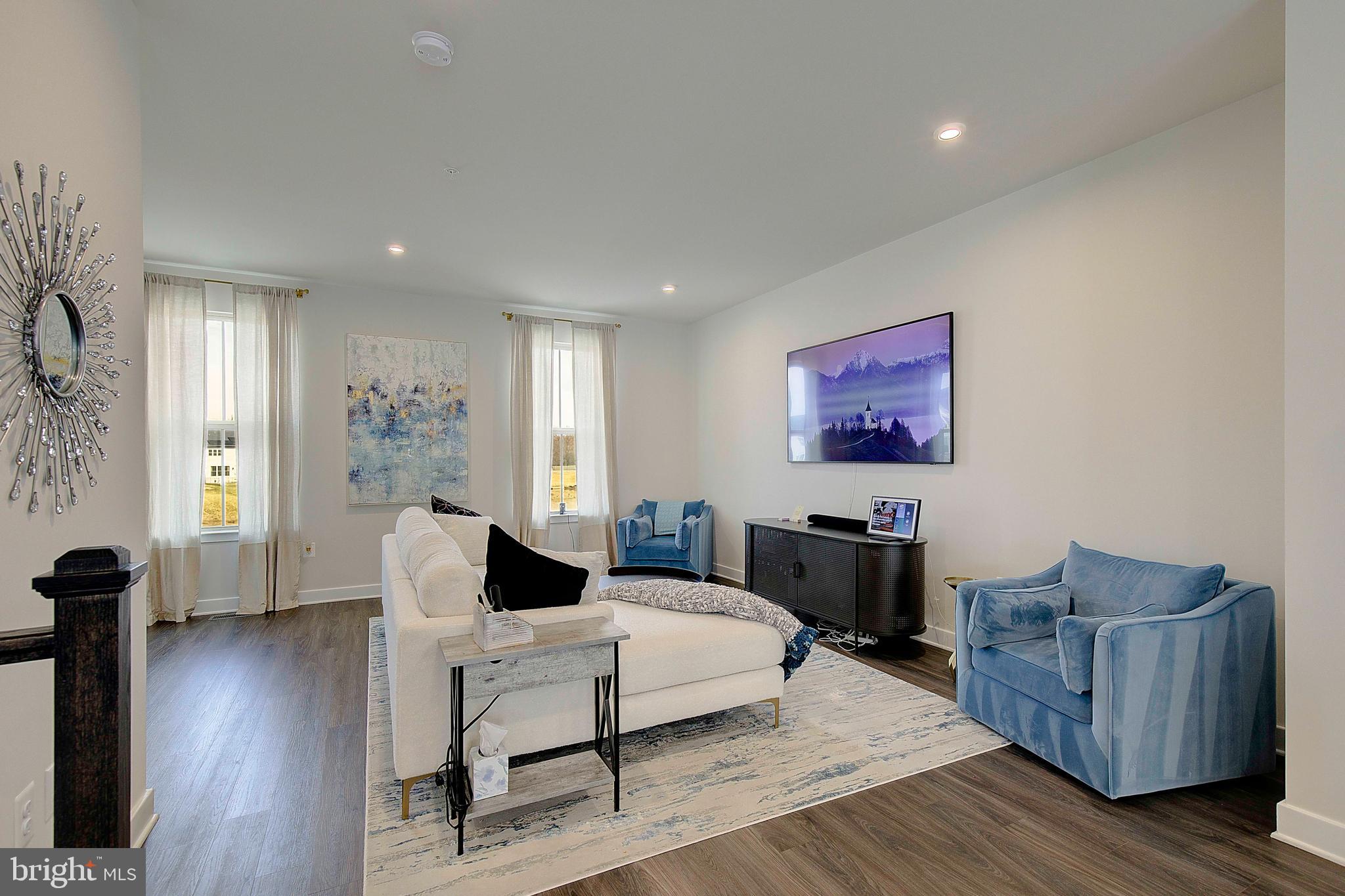 121 Swanson Creek Terrace Laurel, MD 20708 - Photo 13 of 31 a living room with furniture and wooden floor