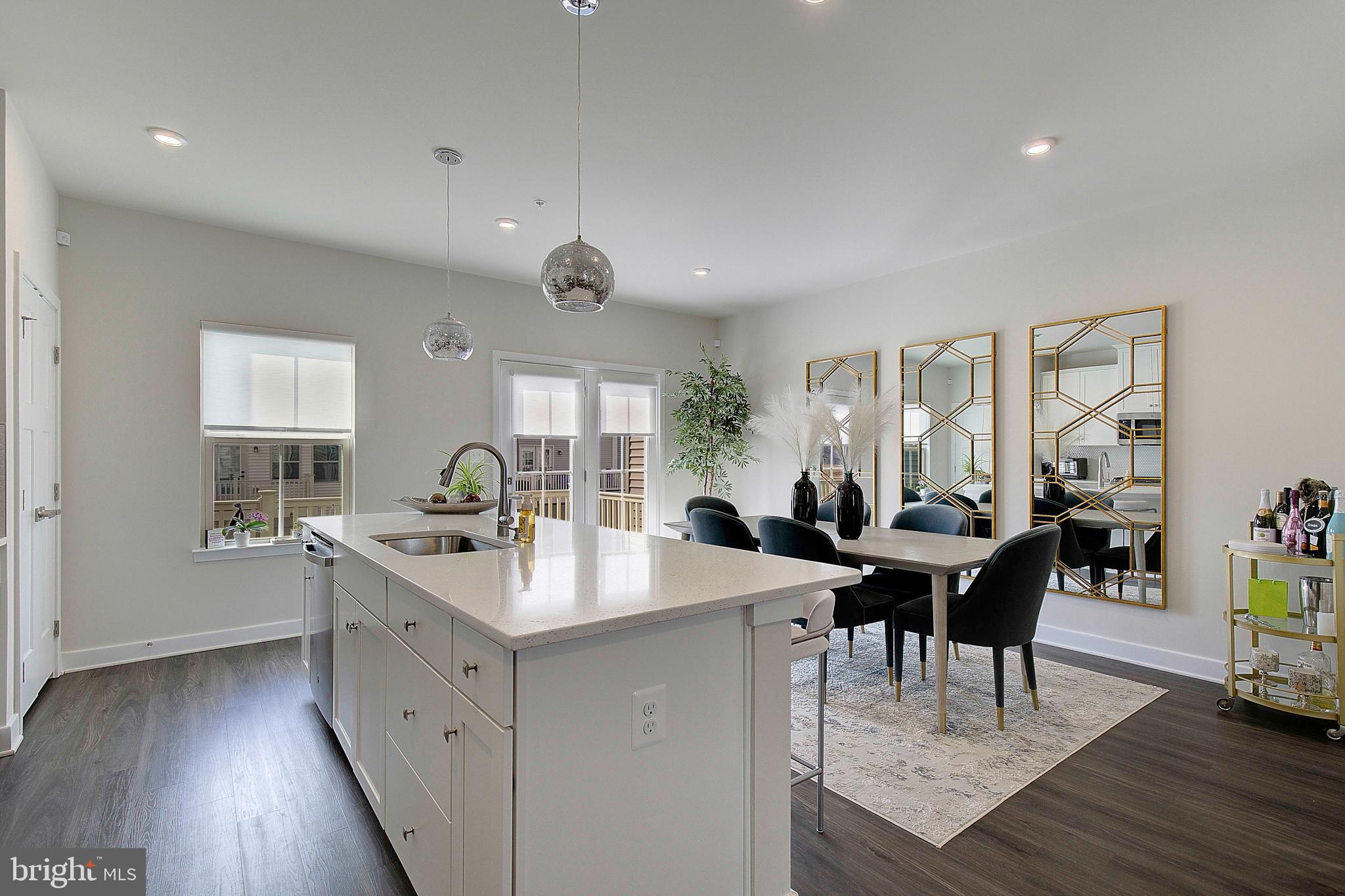 121 Swanson Creek Terrace Laurel, MD 20708 - Photo 15 of 31 a view of a dining room with furniture and wooden floor