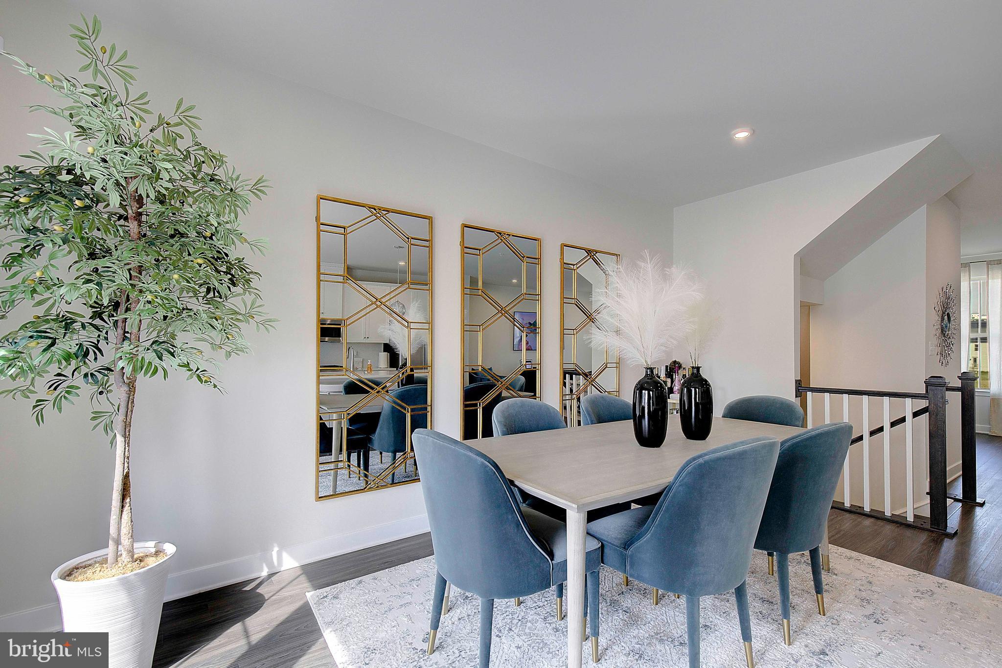 121 Swanson Creek Terrace Laurel, MD 20708 - Photo 19 of 31 a view of a dining room with furniture and wooden floor