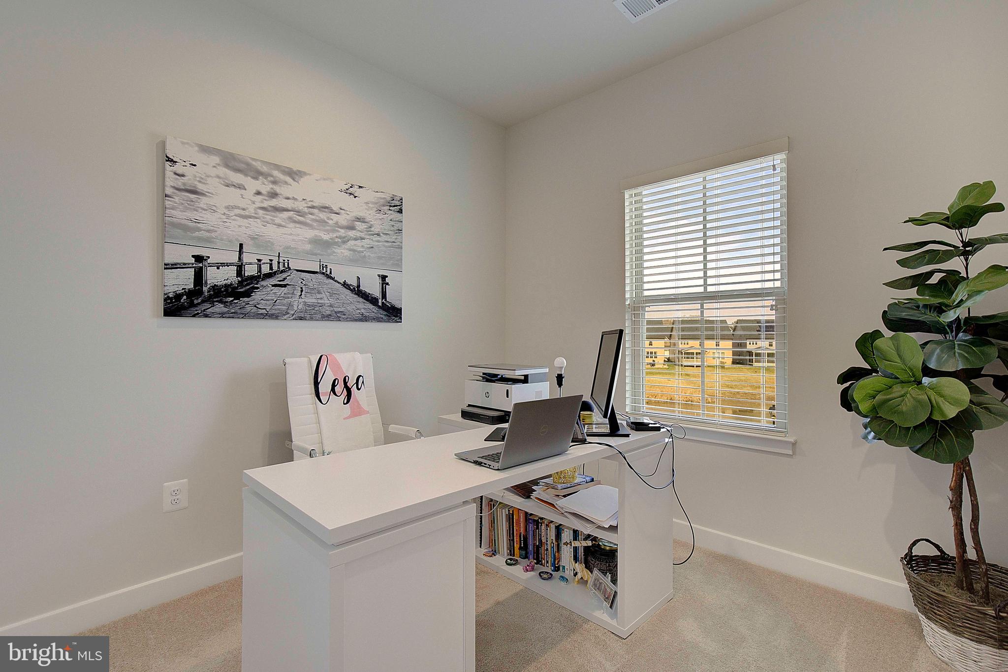 121 Swanson Creek Terrace Laurel, MD 20708 - Photo 22 of 31 a view of a workspace with furniture and a window